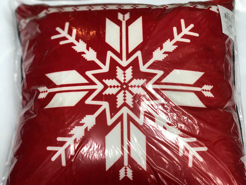 Red pillow with white snowflake
