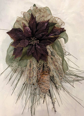 Purple and greenery swag with lace bow