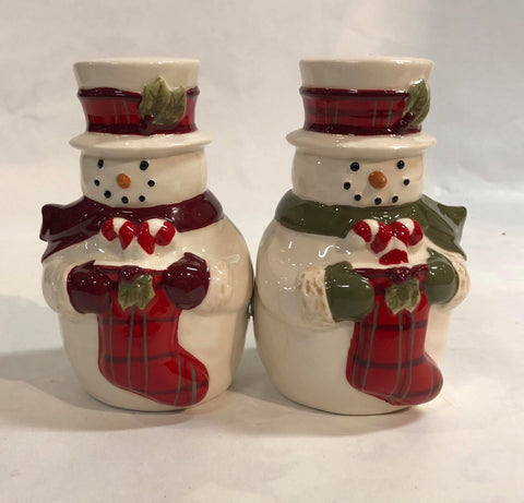 Snowman holding stockings salt and pepper set