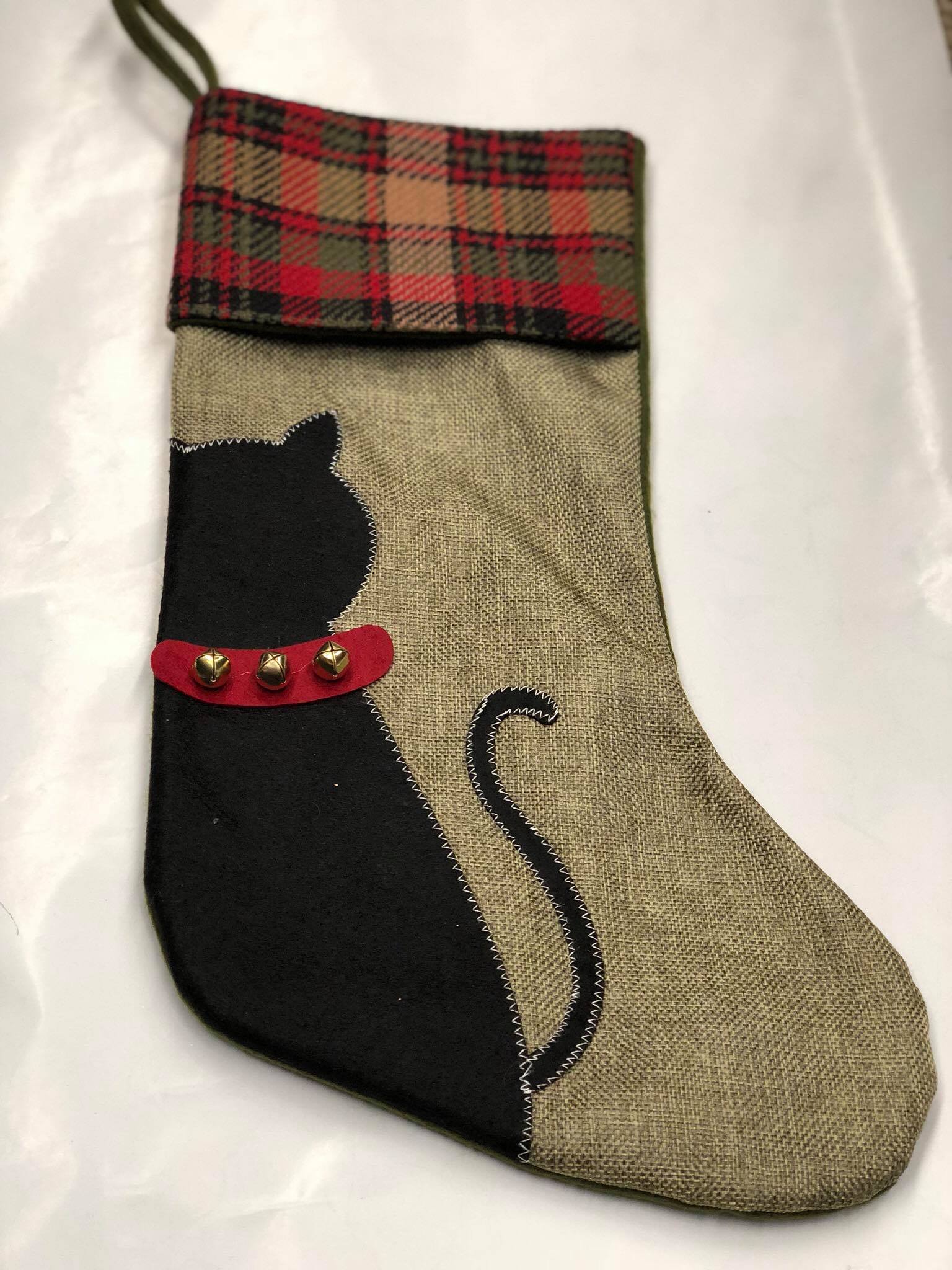 Green burlap stocking with cat silhouette