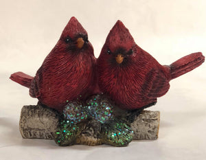 Cardinals sitting on branch figurine