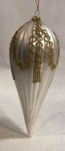 White glass ornament with gold details